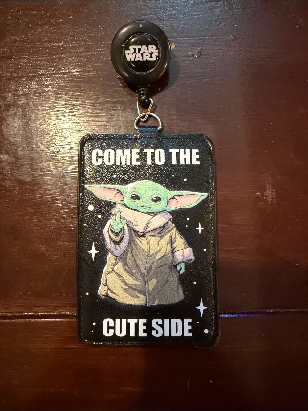 Star Wars Badge Reel with Green Grogu Illustration on Black